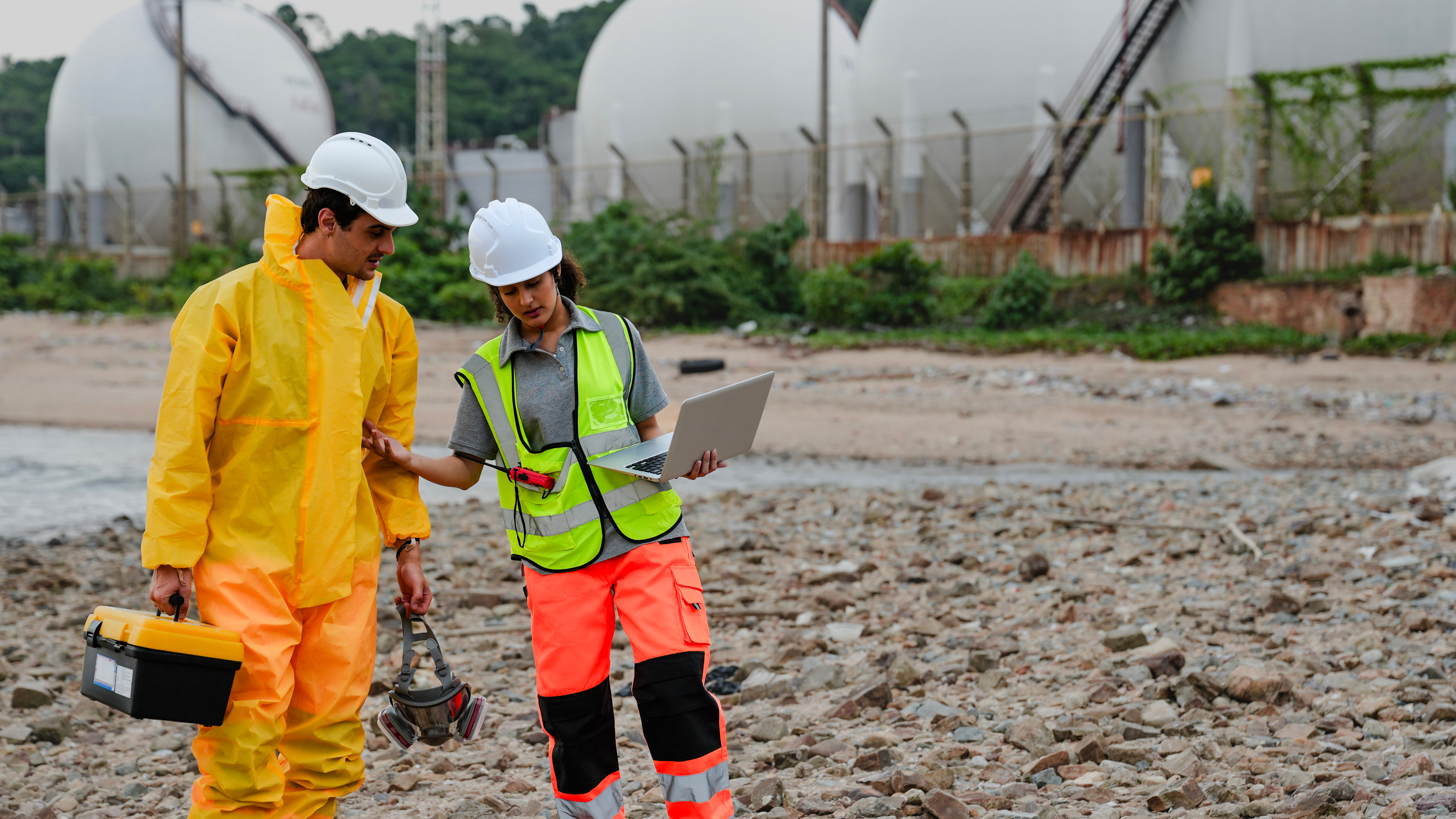 Biologists investigating point source pollution levels near an industrial facility.